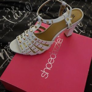 Gently worn White spike sandal.